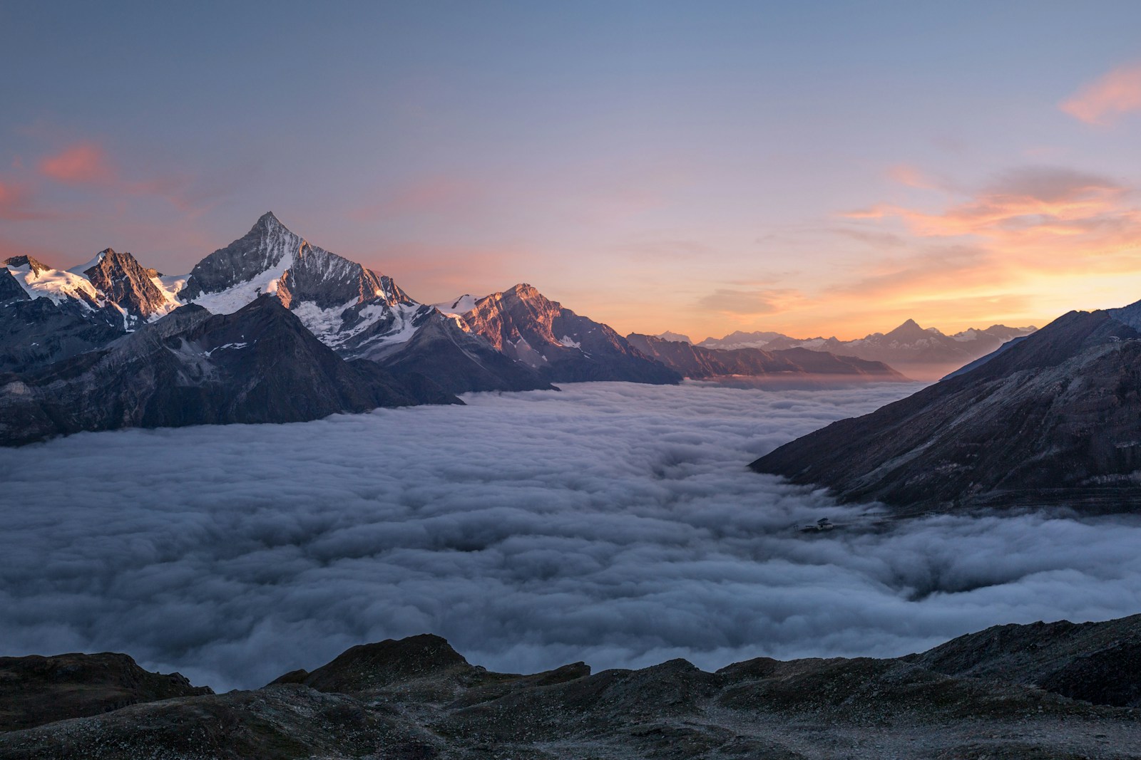 Misty mountain peaks at sunrise