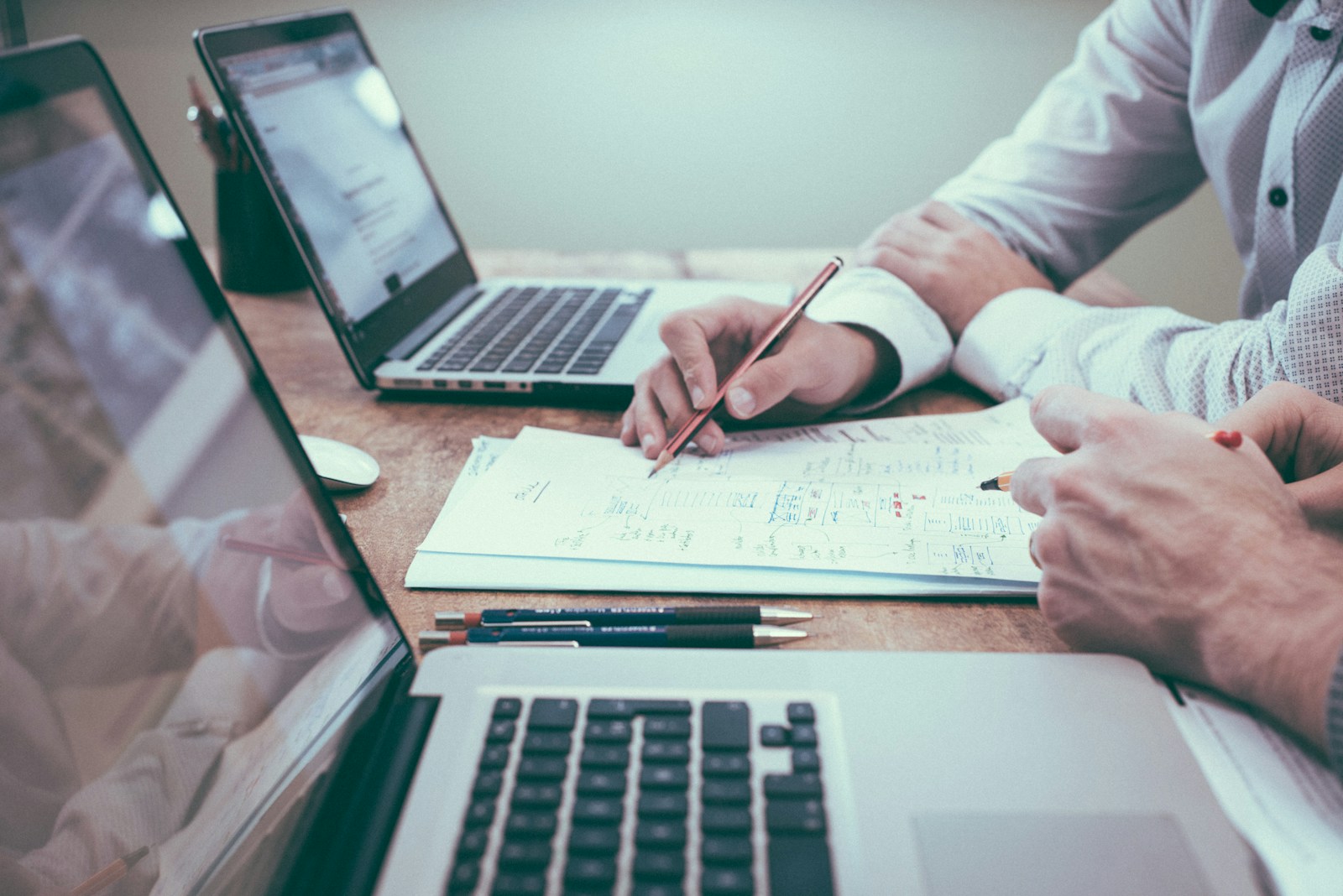 Professional reviewing documents and planning at a desk
