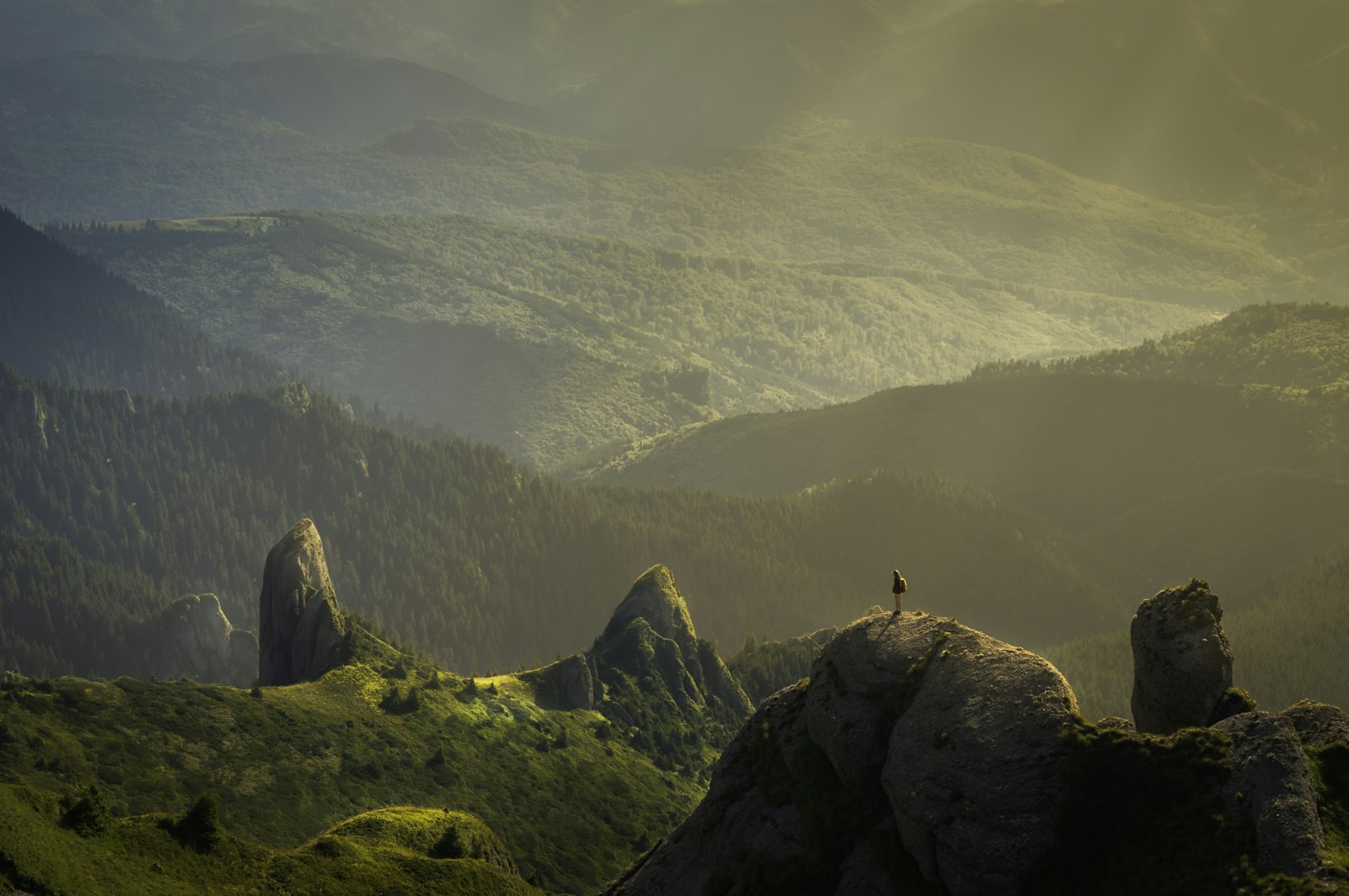 Light breaking over a vast landscape, the kind of view that should still take your breath away